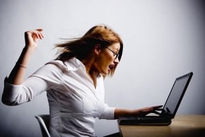Woman angry at laptop