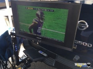 NFL Football game shown in the parking lot off of a DISH Tailgater system